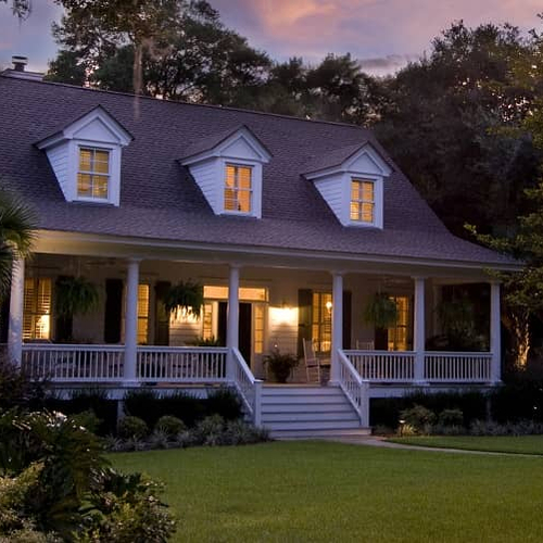 A house at dusk, depicting a home during twilight or evening.